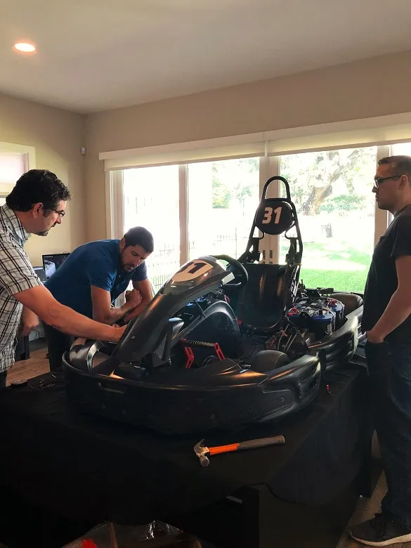 Does a Prototype Have to Work? 6 MAKO's, Kevin Mako, looking over a working prototype for a miniature racecar with Tim Uys, MAKO's Director of Design.