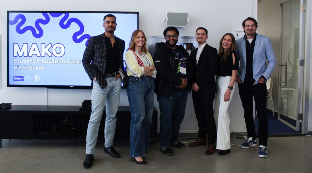 Kiwi Charge Robotic Electric Vehicle Charger Takes Top Prize in Student Pitch Competition at TMU 3 Winner, Adbel Ali, with the MAKO Student Innovation judges